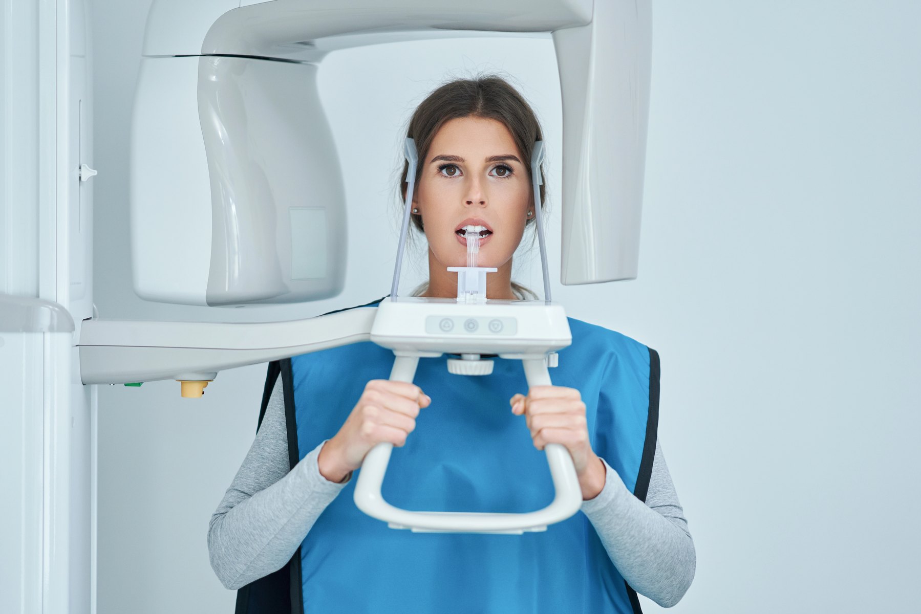 Dentist reviewing a panoramic dental X-ray
