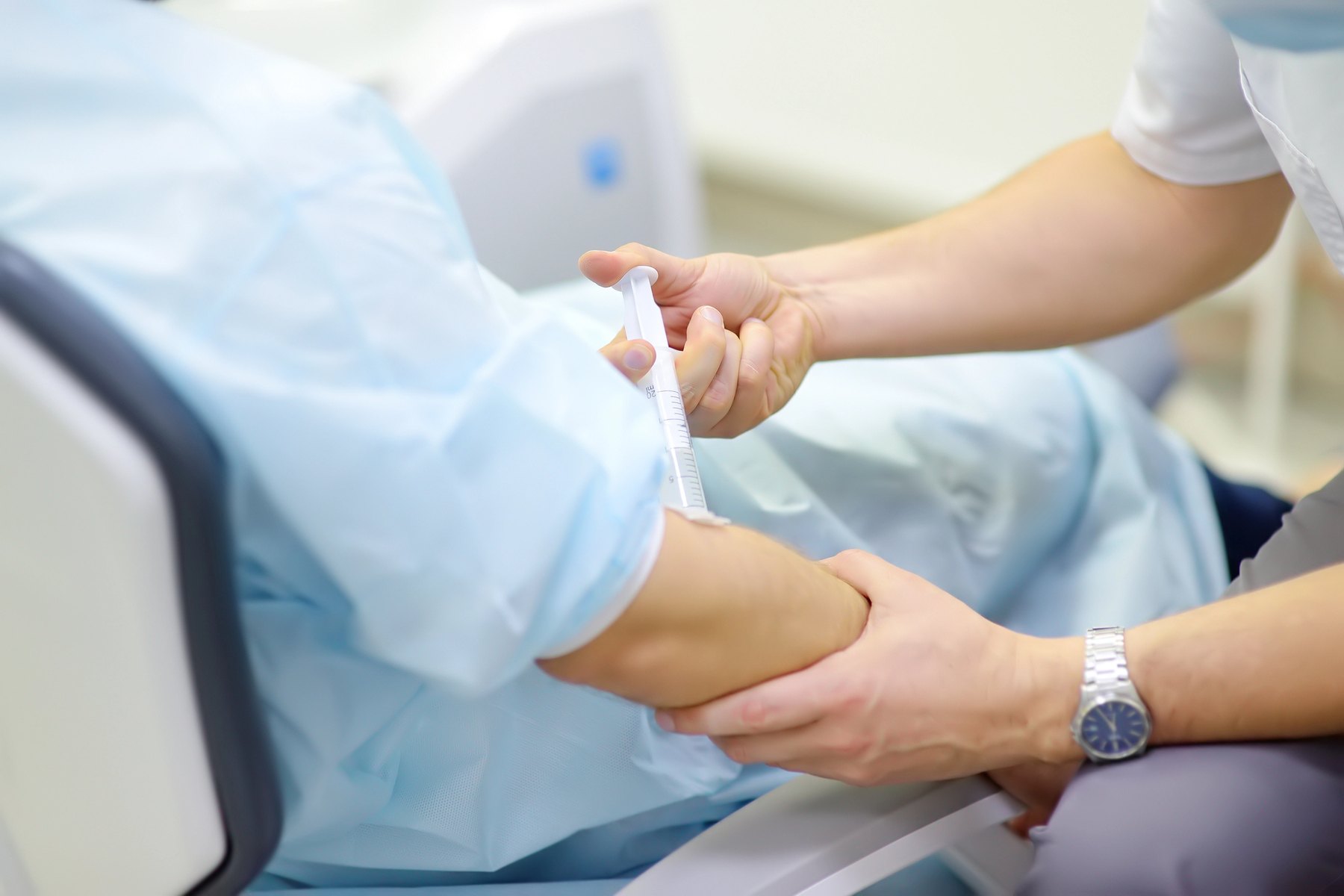 Clinician administering IV sedation