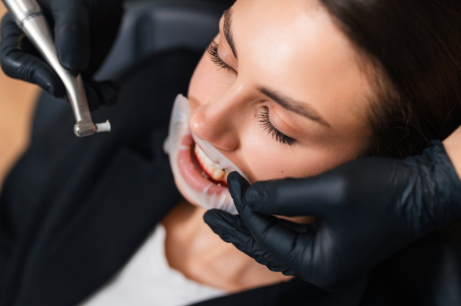 Patient receiving a cosmetic dental treatment